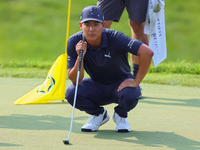 Justin Suh of San Jose, California lines up his putt on the 18th green during the second round during  The Memorial Tournament presented by...