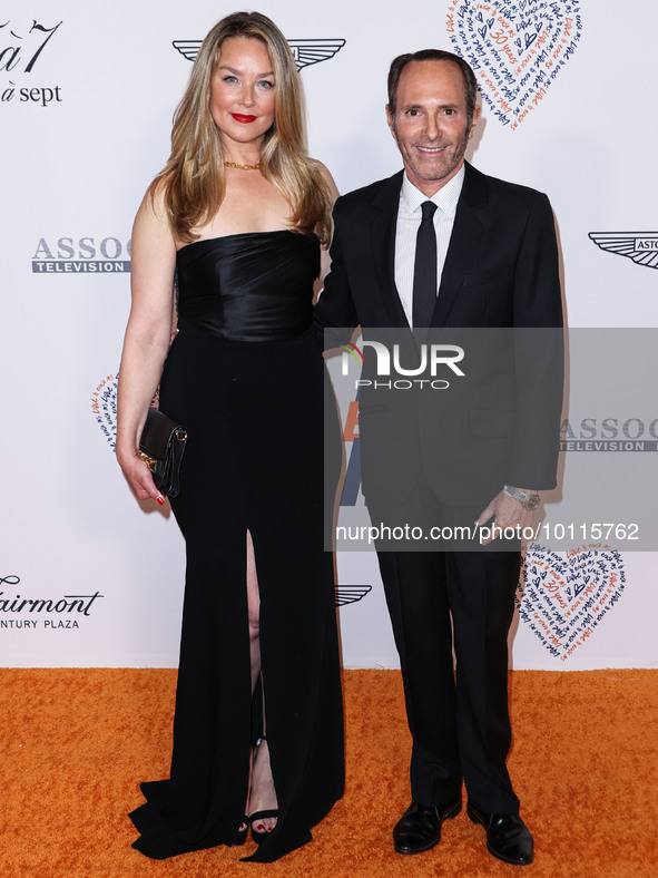 Elisabeth Rohm and husband Peter Glatzer arrive at the 30th Annual Race To Erase MS Gala held at the Fairmont Century Plaza on June 2, 2023...