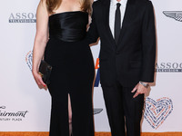 Elisabeth Rohm and husband Peter Glatzer arrive at the 30th Annual Race To Erase MS Gala held at the Fairmont Century Plaza on June 2, 2023...