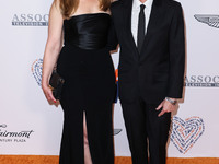 Elisabeth Rohm and husband Peter Glatzer arrive at the 30th Annual Race To Erase MS Gala held at the Fairmont Century Plaza on June 2, 2023...