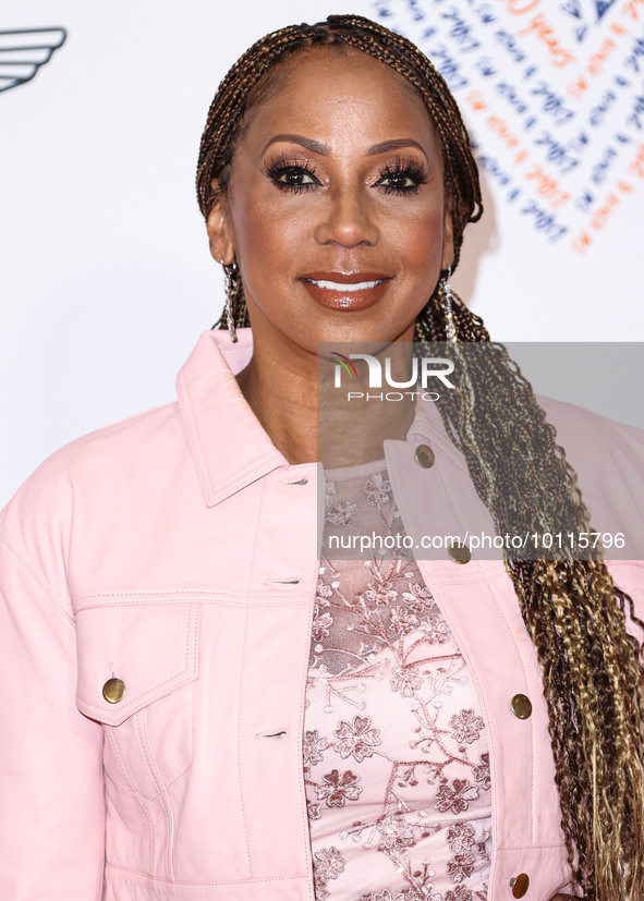 American actress and singer Holly Robinson Peete arrives at the 30th Annual Race To Erase MS Gala held at the Fairmont Century Plaza on June...