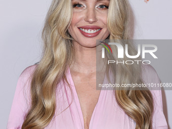 American actress, model and artist Arielle Raycene arrives at the 30th Annual Race To Erase MS Gala held at the Fairmont Century Plaza on Ju...