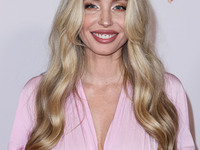 American actress, model and artist Arielle Raycene arrives at the 30th Annual Race To Erase MS Gala held at the Fairmont Century Plaza on Ju...