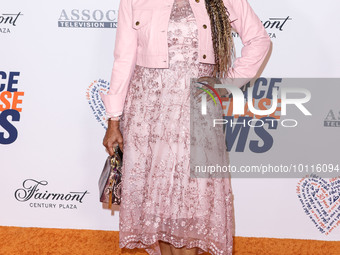 American actress and singer Holly Robinson Peete arrives at the 30th Annual Race To Erase MS Gala held at the Fairmont Century Plaza on June...