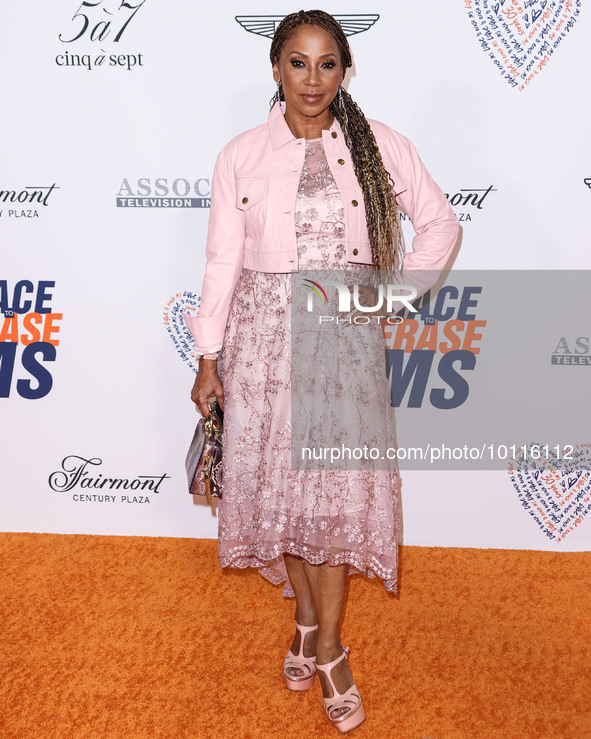 American actress and singer Holly Robinson Peete arrives at the 30th Annual Race To Erase MS Gala held at the Fairmont Century Plaza on June...