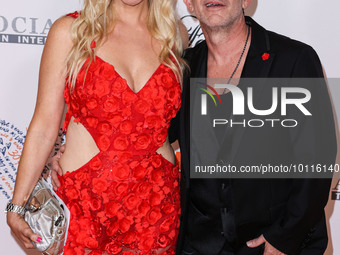 Lindsay Faustino and David Faustino arrive at the 30th Annual Race To Erase MS Gala held at the Fairmont Century Plaza on June 2, 2023 in Ce...