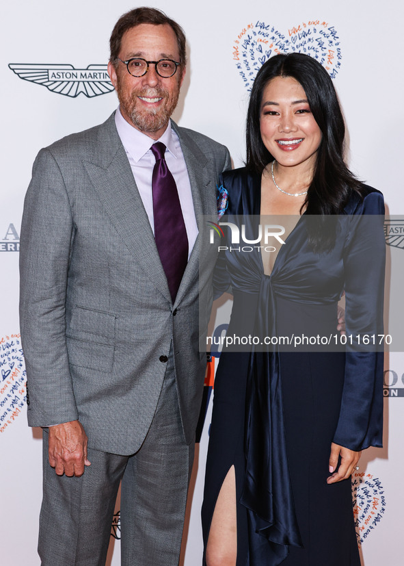 Rob Minkoff and wife Crystal Kung Minkoff arrive at the 30th Annual Race To Erase MS Gala held at the Fairmont Century Plaza on June 2, 2023...