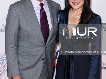 Rob Minkoff and wife Crystal Kung Minkoff arrive at the 30th Annual Race To Erase MS Gala held at the Fairmont Century Plaza on June 2, 2023...