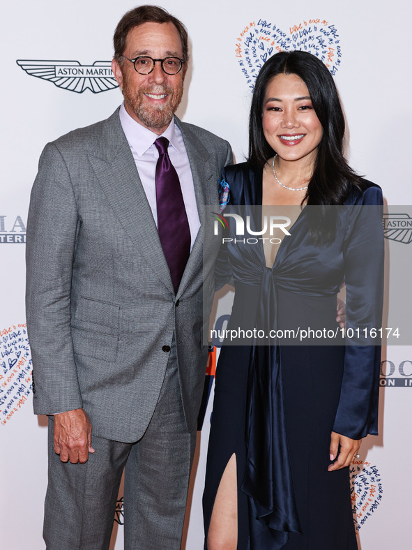 Rob Minkoff and wife Crystal Kung Minkoff arrive at the 30th Annual Race To Erase MS Gala held at the Fairmont Century Plaza on June 2, 2023...