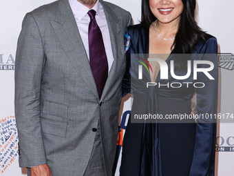 Rob Minkoff and wife Crystal Kung Minkoff arrive at the 30th Annual Race To Erase MS Gala held at the Fairmont Century Plaza on June 2, 2023...