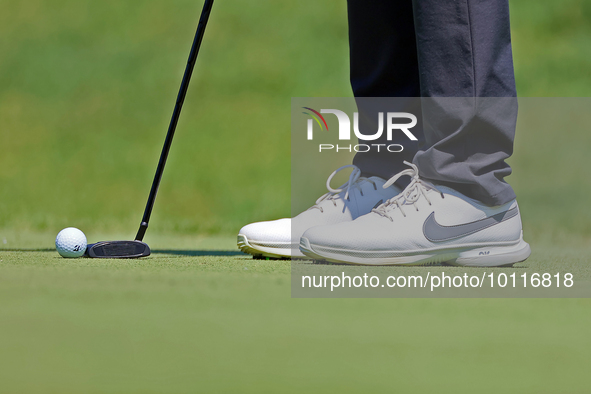 Closeup of the shoes worn by Jason Day of Brisbane, Australia as he putts on the 8th green during  The Memorial Tournament presented by Work...