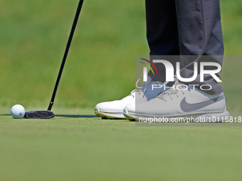 Closeup of the shoes worn by Jason Day of Brisbane, Australia as he putts on the 8th green during  The Memorial Tournament presented by Work...