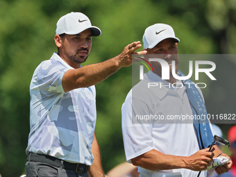 Jason Day of Brisbane, Australia looks over the 8th green with his caddy during The Memorial Tournament presented by Workday at Muirfield Vi...