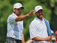 Jason Day of Brisbane, Australia looks over the 8th green with his caddy during The Memorial Tournament presented by Workday at Muirfield Vi...