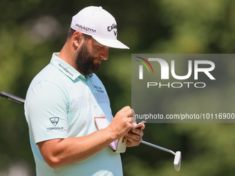 John Rahm of Barrika, Spain writes in his yardage book on the 8th green during The Memorial Tournament presented by Workday at Muirfield Vil...