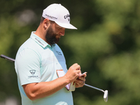 John Rahm of Barrika, Spain writes in his yardage book on the 8th green during The Memorial Tournament presented by Workday at Muirfield Vil...