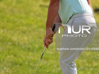 John Rahm of Barrika, Spain chips onto the 9th green during The Memorial Tournament presented by Workday at Muirfield Village Golf Club in D...