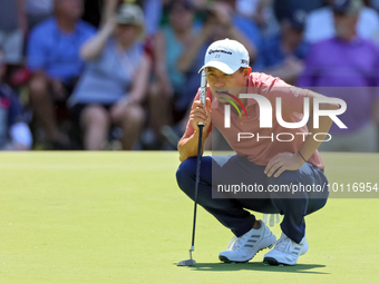 Collin Morikawa of La Canada, California lines up his putt on the 7th green during The Memorial Tournament presented by Workday at Muirfield...