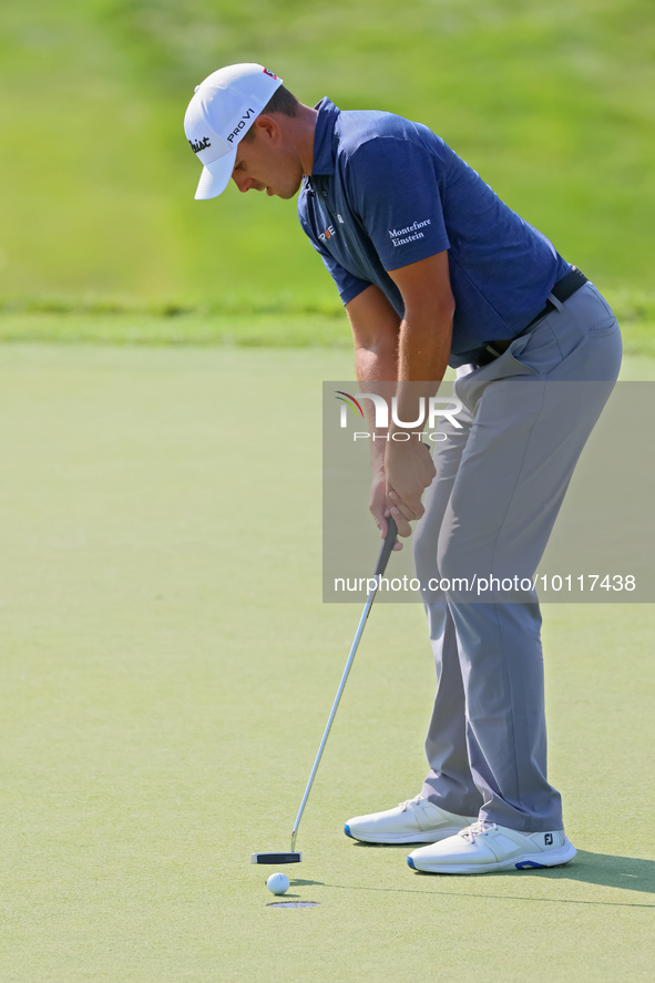 Joseph Bramlett of Las Vegas, Nevada putts on the 18th green after completing the second round during  The Memorial Tournament presented by...