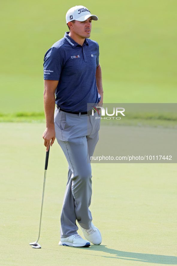 Joseph Bramlett of Las Vegas, Nevada waits on the 18th green after completing the second round during  The Memorial Tournament presented by...