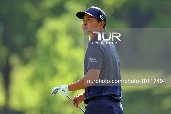 Justin Suh of San Jose, California follows his shot from the 18th fairway during the second round during  The Memorial Tournament presented...