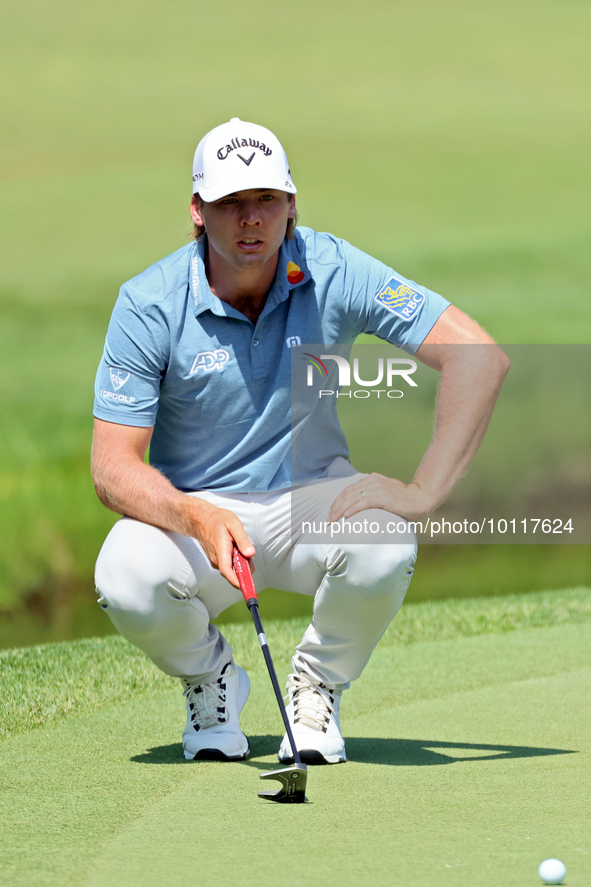 Sam Burns of Shreveport, Louisiana lines up his putt on the 10th green during The Memorial Tournament presented by Workday at Muirfield Vill...