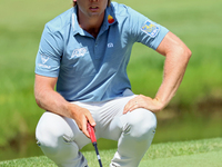 Sam Burns of Shreveport, Louisiana lines up his putt on the 10th green during The Memorial Tournament presented by Workday at Muirfield Vill...