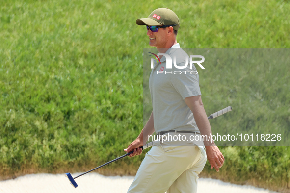 Adam Scott of Gold Coast, Queensland, Australia walks on the 18th green during The Memorial Tournament presented by Workday at Muirfield Vil...