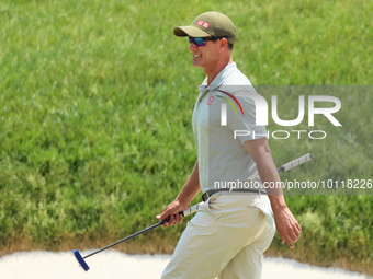 Adam Scott of Gold Coast, Queensland, Australia walks on the 18th green during The Memorial Tournament presented by Workday at Muirfield Vil...