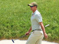 Adam Scott of Gold Coast, Queensland, Australia walks on the 18th green during The Memorial Tournament presented by Workday at Muirfield Vil...