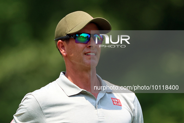 Adam Scott of Gold Coast, Queensland, Australia looks down the 18th fairway during The Memorial Tournament presented by Workday at Muirfield...