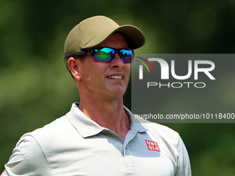 Adam Scott of Gold Coast, Queensland, Australia looks down the 18th fairway during The Memorial Tournament presented by Workday at Muirfield...