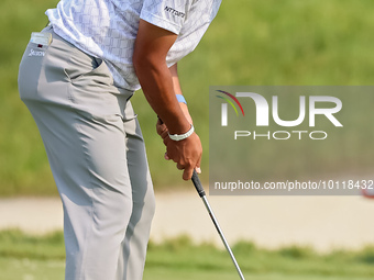 Hideki Matsuyama of Sendai, Japan putts on the 18th green during The Memorial Tournament presented by Workday at Muirfield Village Golf Club...