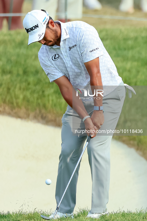 Hideki Matsuyama of Sendai, Japan chips from the fringe onto the 18th green during The Memorial Tournament presented by Workday at Muirfield...