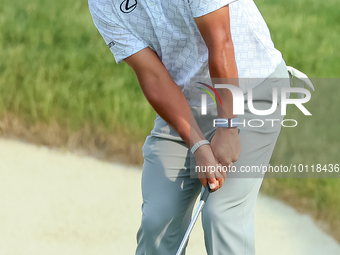 Hideki Matsuyama of Sendai, Japan chips from the fringe onto the 18th green during The Memorial Tournament presented by Workday at Muirfield...