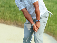 Hideki Matsuyama of Sendai, Japan chips from the fringe onto the 18th green during The Memorial Tournament presented by Workday at Muirfield...