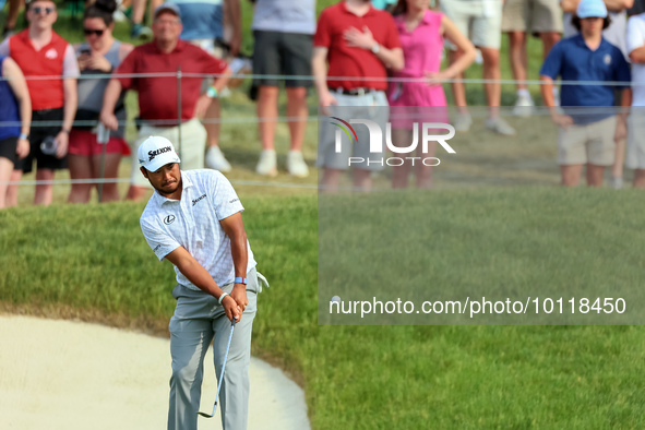 Hideki Matsuyama of Sendai, Japan chips from the fringe onto the 18th green during The Memorial Tournament presented by Workday at Muirfield...