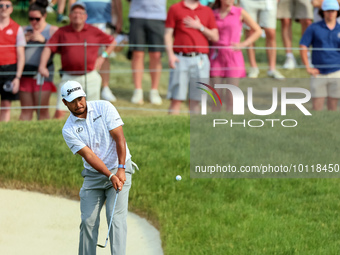 Hideki Matsuyama of Sendai, Japan chips from the fringe onto the 18th green during The Memorial Tournament presented by Workday at Muirfield...