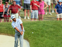 Hideki Matsuyama of Sendai, Japan chips from the fringe onto the 18th green during The Memorial Tournament presented by Workday at Muirfield...