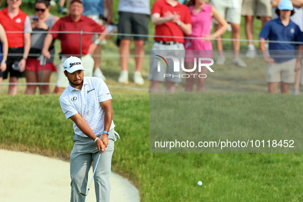 Hideki Matsuyama of Sendai, Japan chips from the fringe onto the 18th green during The Memorial Tournament presented by Workday at Muirfield...