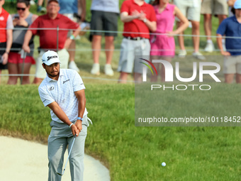 Hideki Matsuyama of Sendai, Japan chips from the fringe onto the 18th green during The Memorial Tournament presented by Workday at Muirfield...