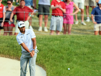 Hideki Matsuyama of Sendai, Japan chips from the fringe onto the 18th green during The Memorial Tournament presented by Workday at Muirfield...