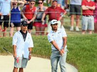 Hideki Matsuyama of Sendai, Japan watches his chip shot from the fringe onto the 18th green during The Memorial Tournament presented by Work...