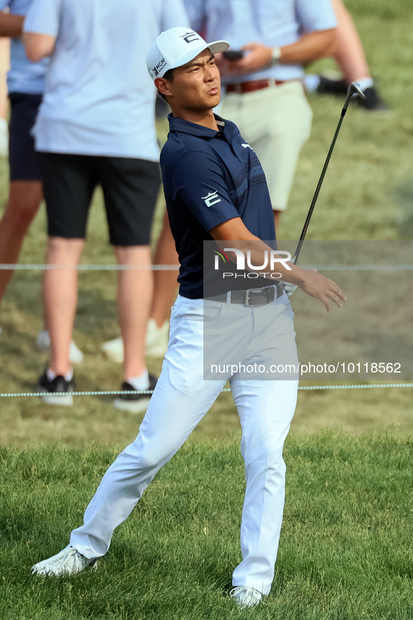 Justin Suh of San Jose, California reacts after making his shot on the 18th green during The Memorial Tournament presented by Workday at Mui...