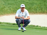 David Lipsky of Las Vegas, Nevada lines up his putt on the 18th green during The Memorial Tournament presented by Workday at Muirfield Villa...