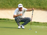 David Lipsky of Las Vegas, Nevada lines up his putt on the 18th green during The Memorial Tournament presented by Workday at Muirfield Villa...