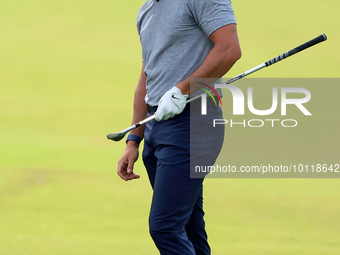 Rory McIlroy of Holywood, Northern Ireland reacts after hitting from the 18th fairway during The Memorial Tournament presented by Workday at...