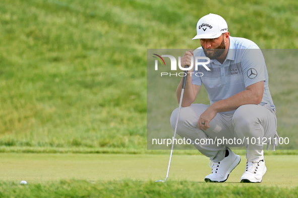 Jon Rahm of Barrika, Spain lines up his putt on the 18th green during The Memorial Tournament presented by Workday at Muirfield Village Golf...