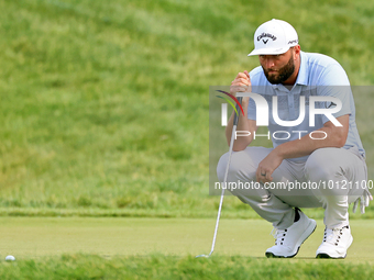 Jon Rahm of Barrika, Spain lines up his putt on the 18th green during The Memorial Tournament presented by Workday at Muirfield Village Golf...