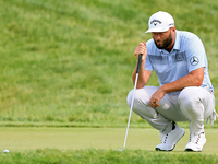 Jon Rahm of Barrika, Spain lines up his putt on the 18th green during The Memorial Tournament presented by Workday at Muirfield Village Golf...